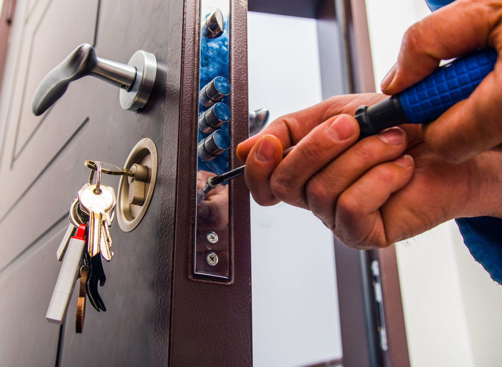 Emergency locksmith repairing a door lock in San Diego
