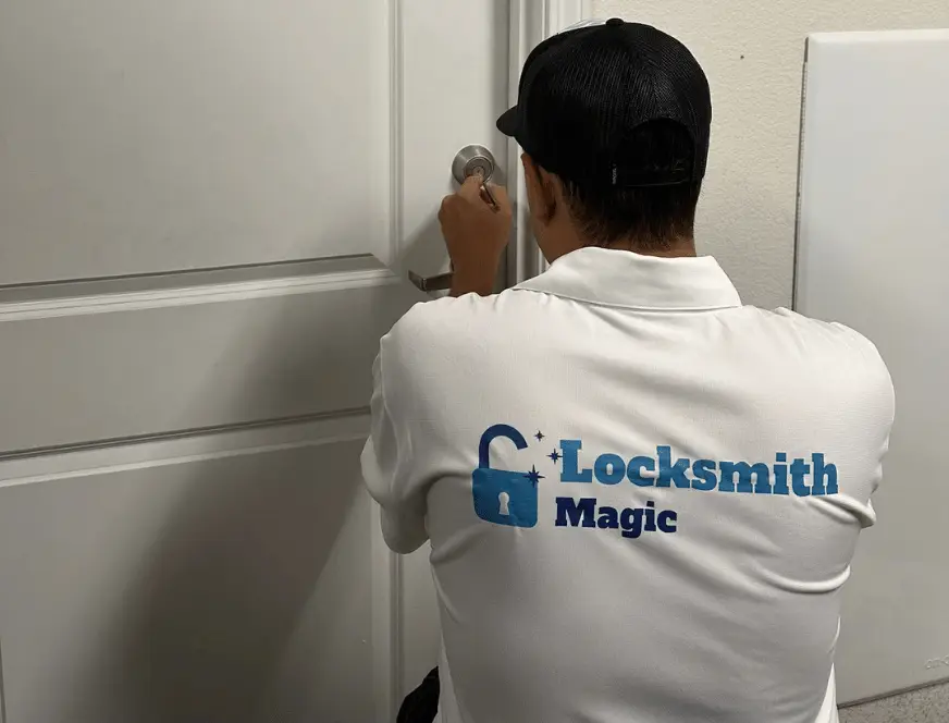 Residential locksmith installing new lock on front door